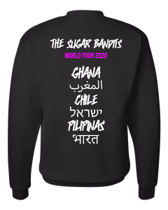 The back of a black crewneck sweater has The Sugar Bandits written in white across the top center, World Tour 2020 is written in hot pink underneath that. Then centered down the middle below that are all written in white are the tour stops: Ghana, Morocco written in Arabic, Chile, Israel written in Hebrew, the Philippines written in Tagalog, and India written in Hindi.