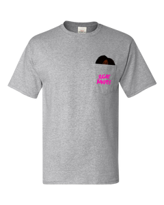 A heather gray t-shirt with a pocket. The The Sugar Bandits logo is printed in hot pink on the outside of the pocket and The Sugar Bandits Bandit is peaking out from inside the pocket.