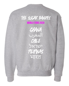 The back of a heather gray crewneck sweater has The Sugar Bandits written in white across the top center, World Tour 2020 is written in hot pink underneath that. Then centered down the middle below that are all written in white are the tour stops: Ghana, Morocco written in Arabic, Chile, Israel written in Hebrew, the Philippines written in Tagalog, and India written in Hindi.